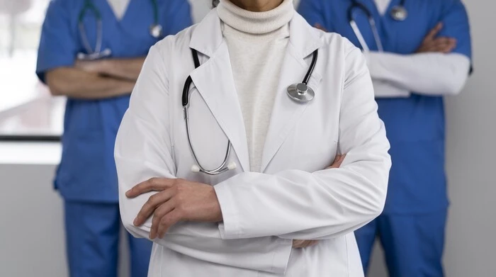 doctor team hands folded